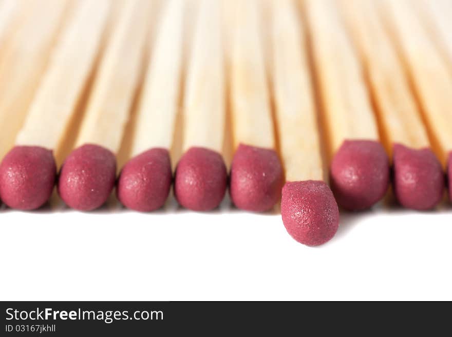 Macro view of row of matches isolated over white