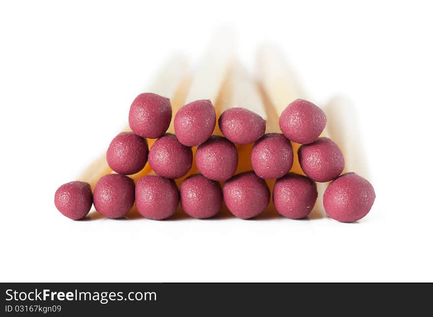 Macro view of stack of matches isolated over white. Macro view of stack of matches isolated over white