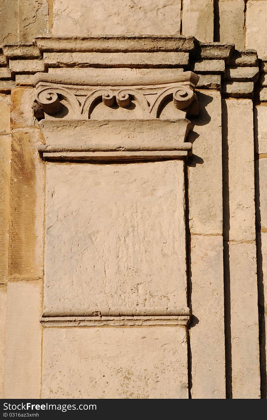 Fragment of the historic building, old column.