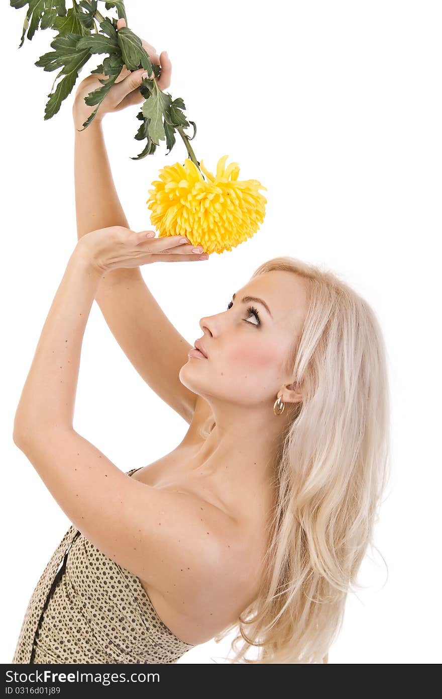 sweet girl with a beautiful yellow flower in the hands of. sweet girl with a beautiful yellow flower in the hands of