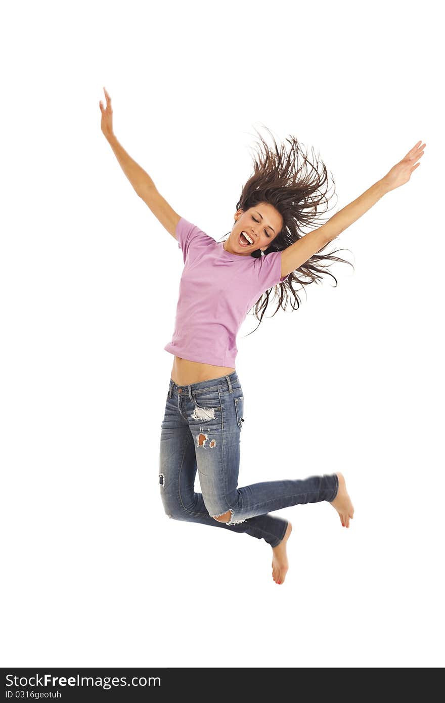 Cute young woman with jeans jumping energetically