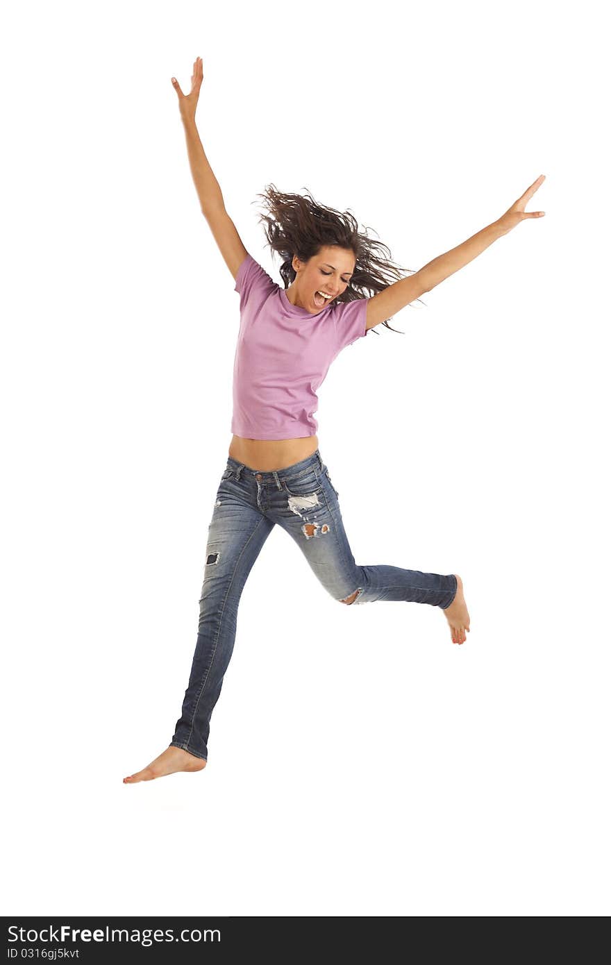 Cute young woman with jeans jumping energetically