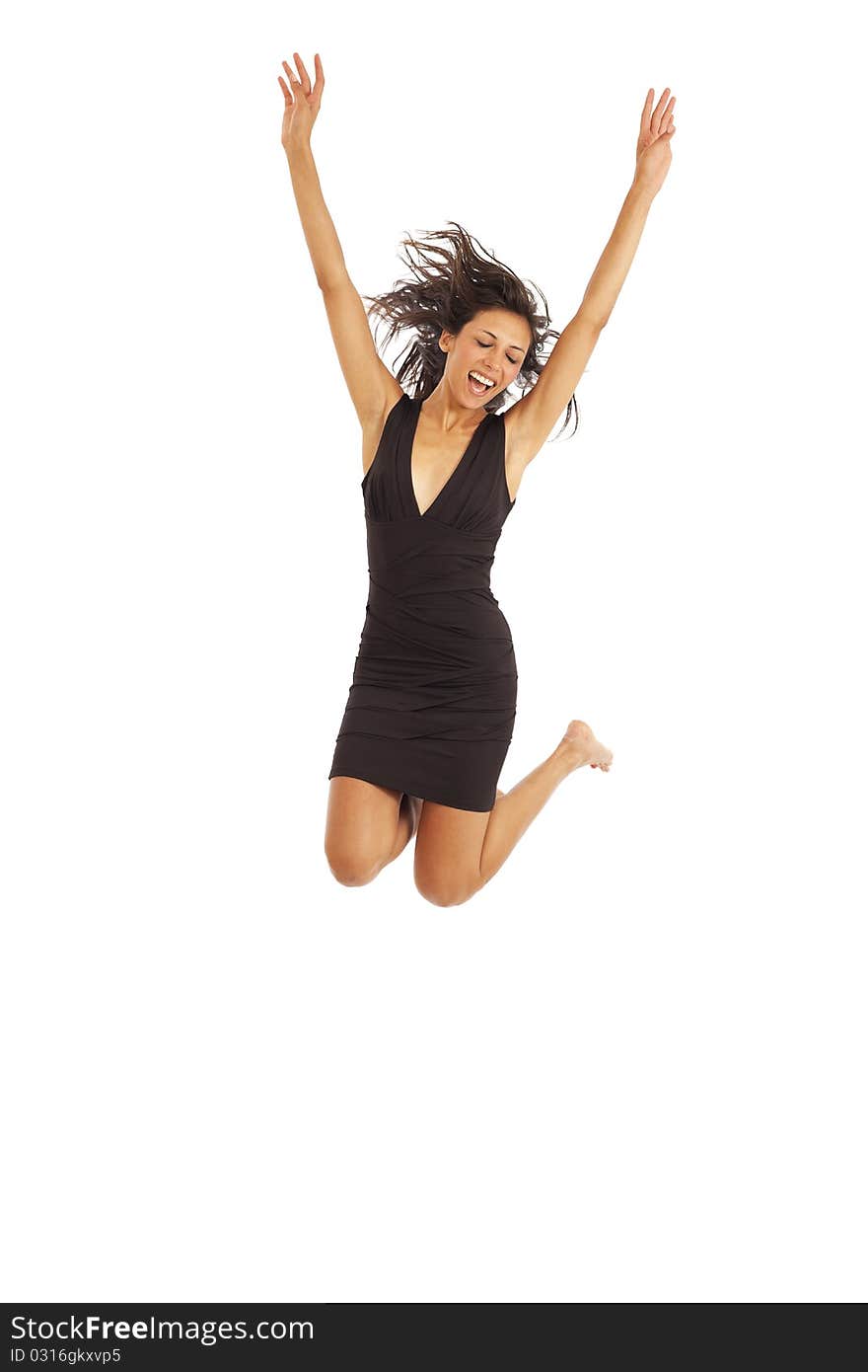 Cute young woman with black dress jumping energetically