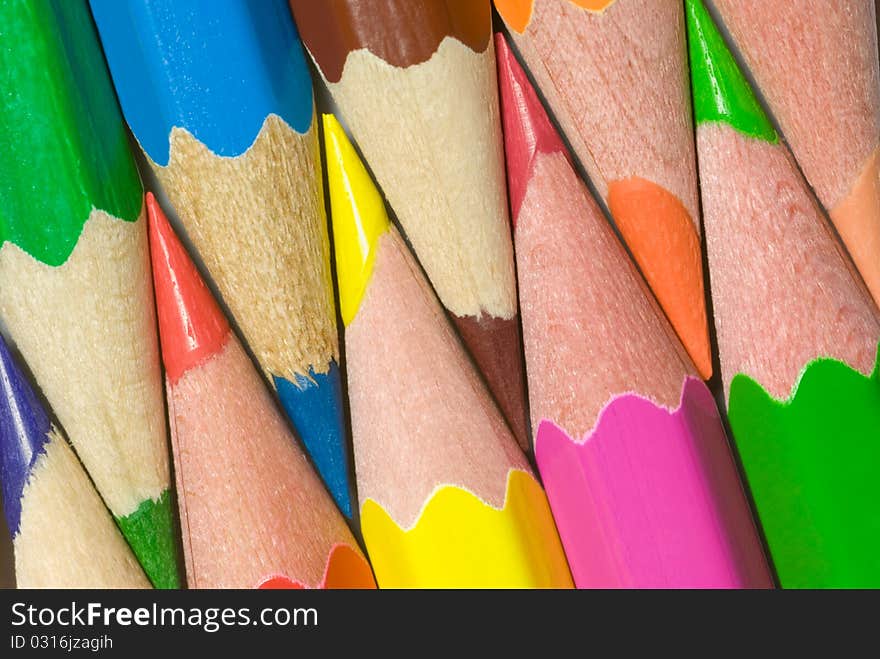 Multi-coloured pencils are close each other. Multi-coloured pencils are close each other.