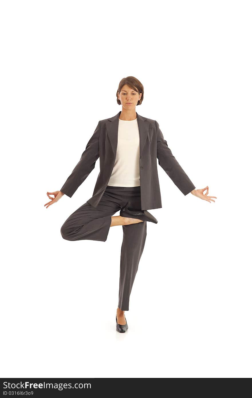 Young businesswoman in suit doing yoga. Young businesswoman in suit doing yoga