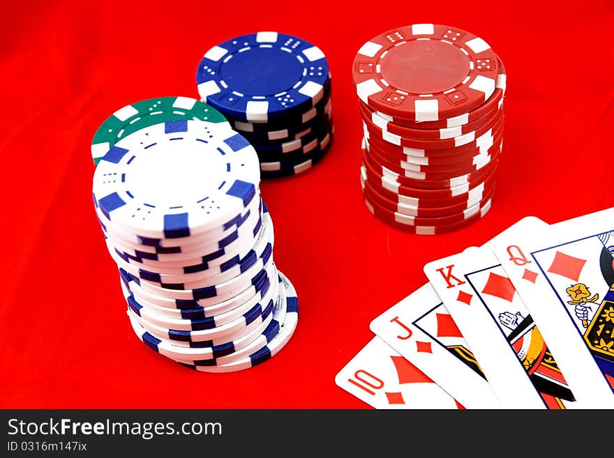 Poker chips isolated on red