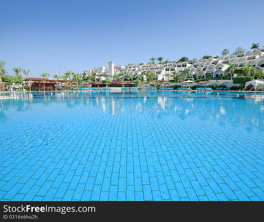 Huge swimmingpool in fron of beautiful hotel. Huge swimmingpool in fron of beautiful hotel