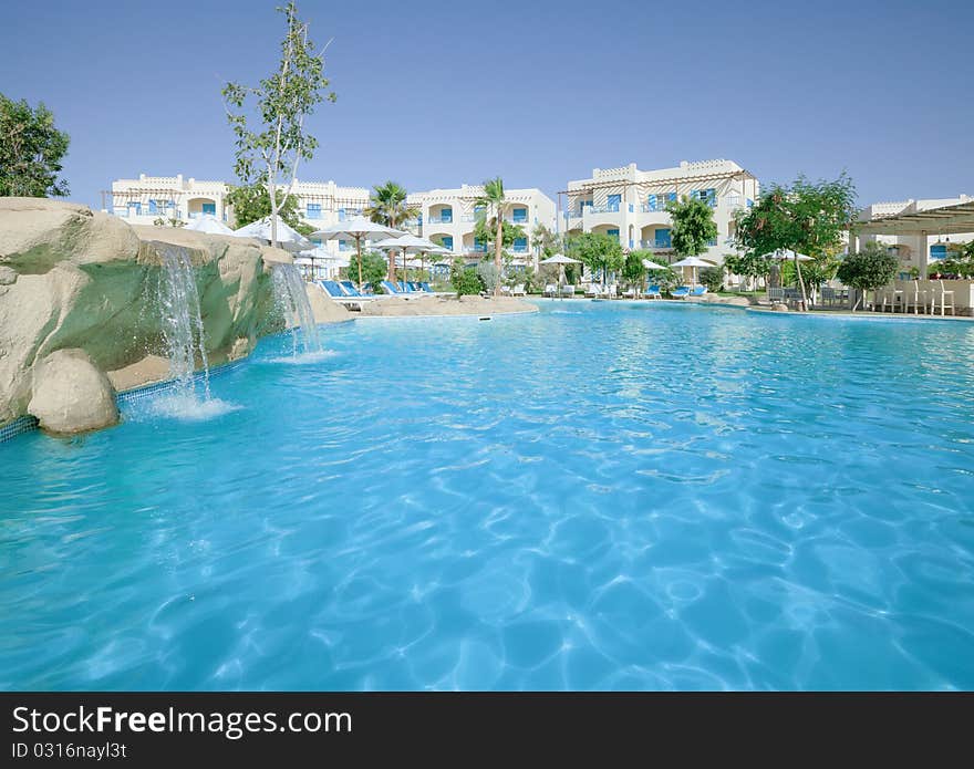 Large fresh swimmingpool in comfy hotel yard