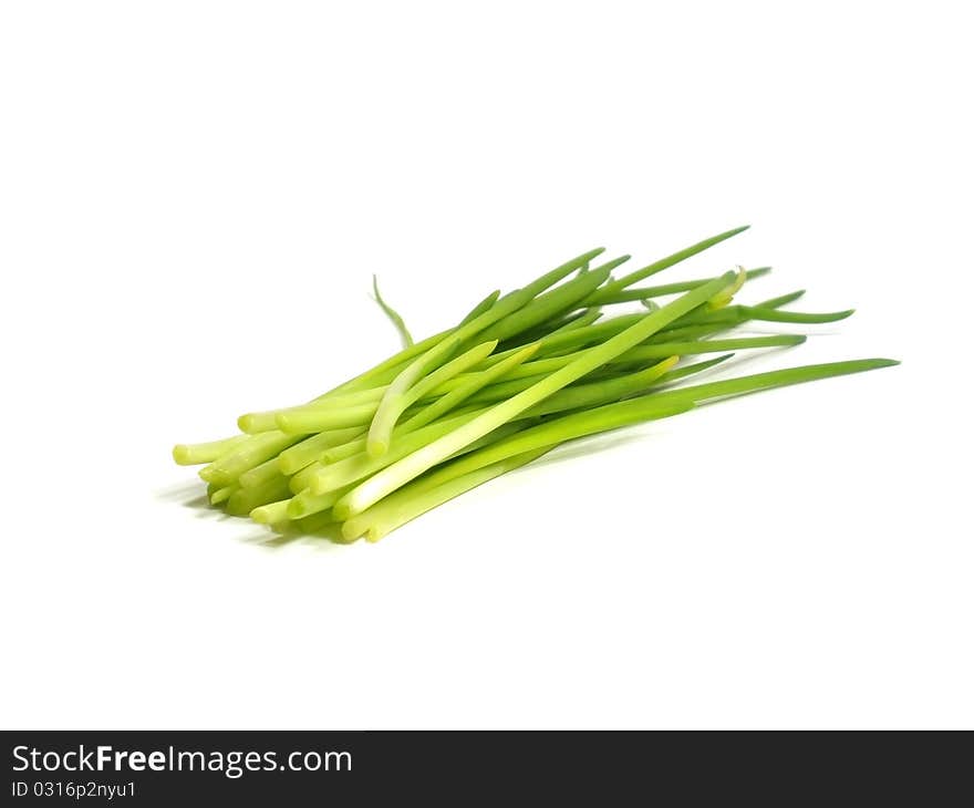 Young green onions on the white isolate background