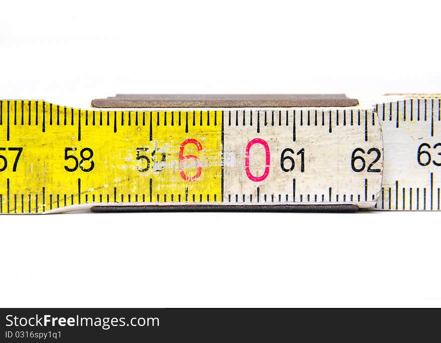 Close up of a yellow and white colored yardstick over white background. Close up of a yellow and white colored yardstick over white background