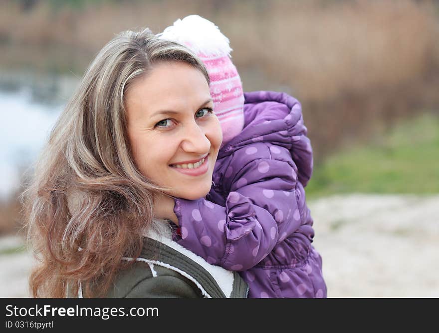 Mother holding a baby outdoor