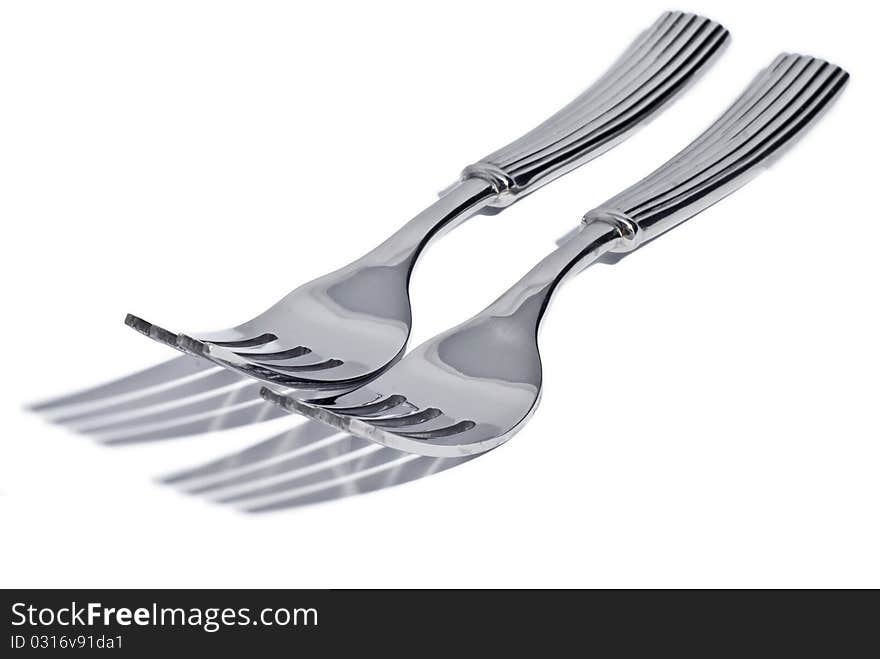 Cutlery lying on a white background