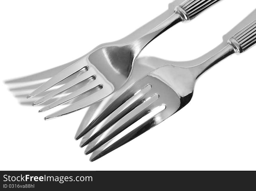 Cutlery lying on a white background