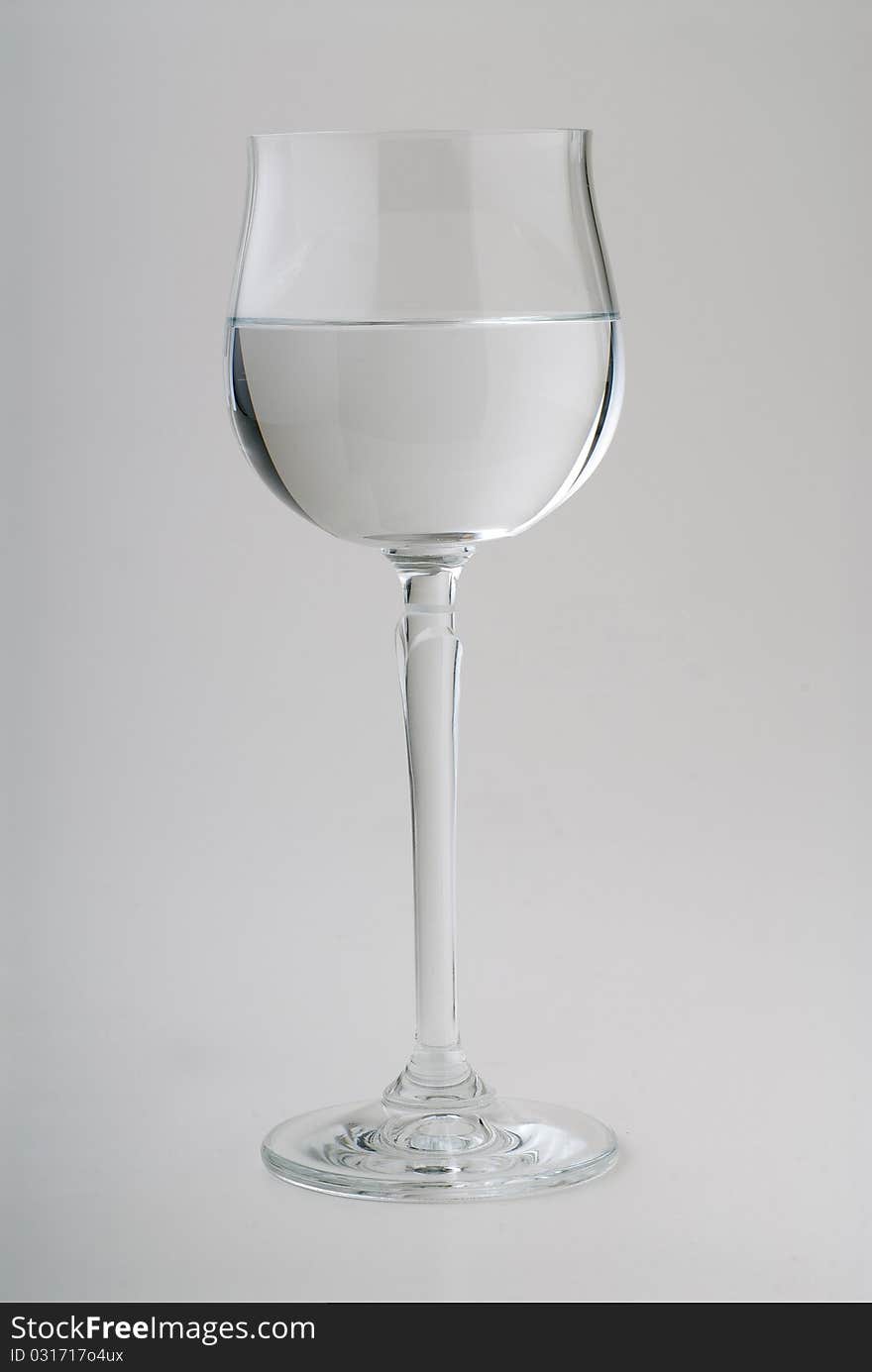 Crystal glass half full of water