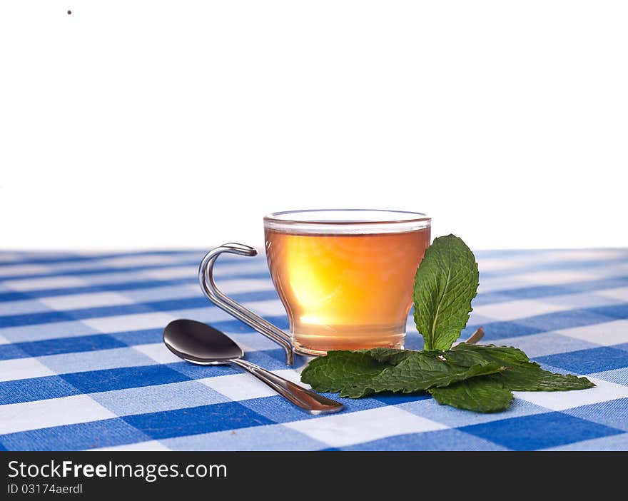 Herbal tea on blue tablecloth