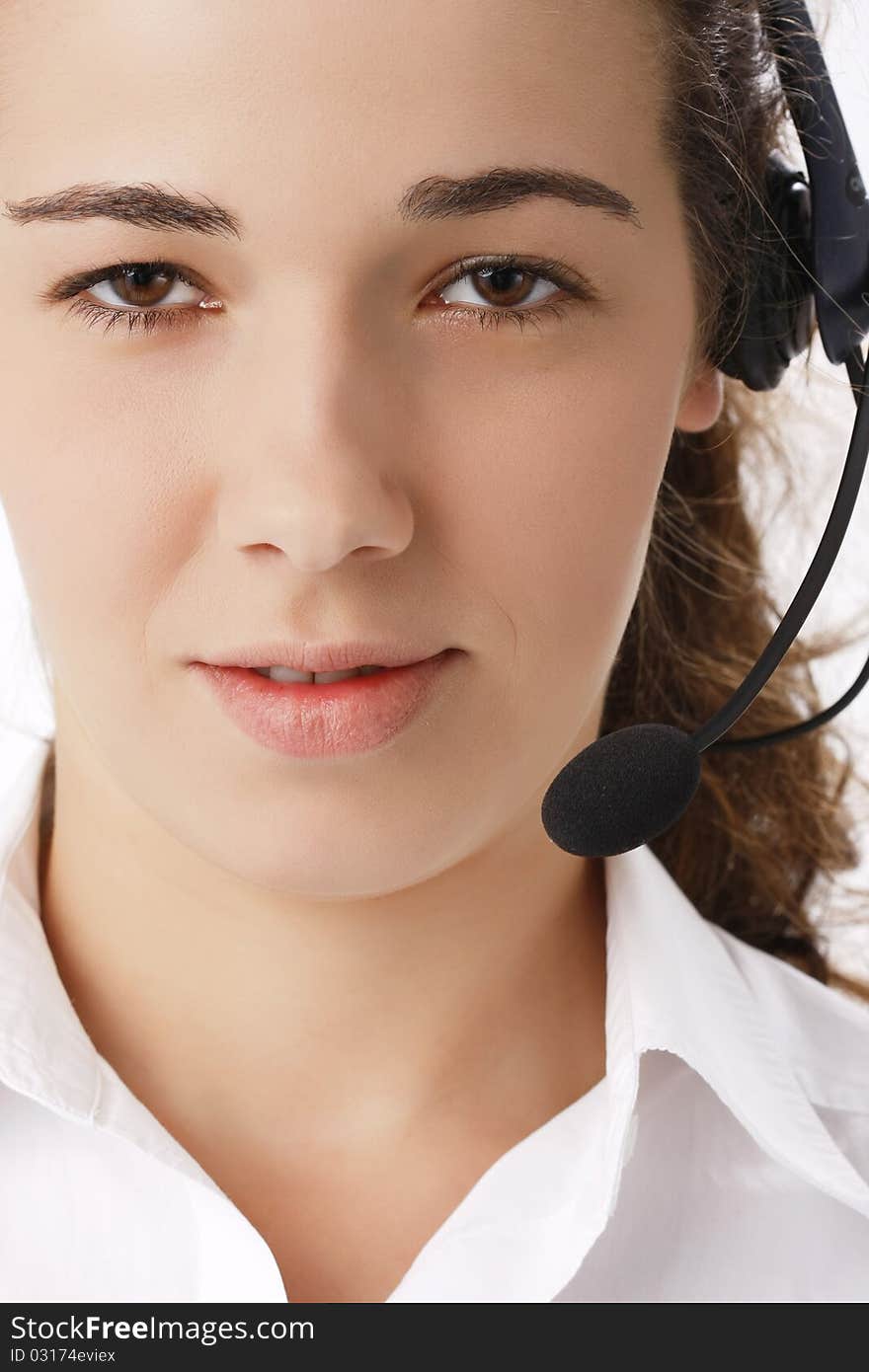 Young beautiful business woman using head phone