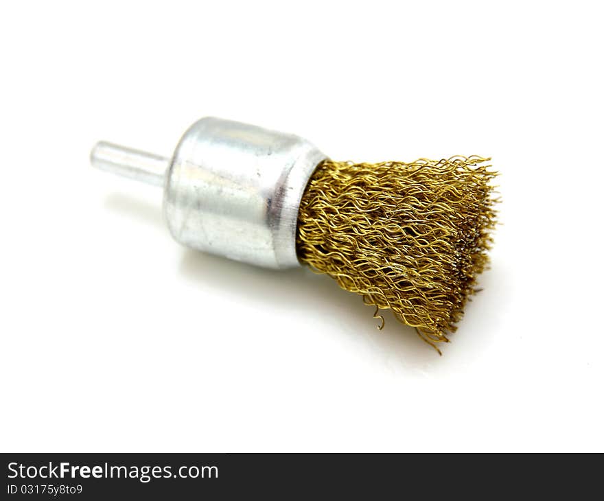 Yellow brush of rotation of a wire on a white background