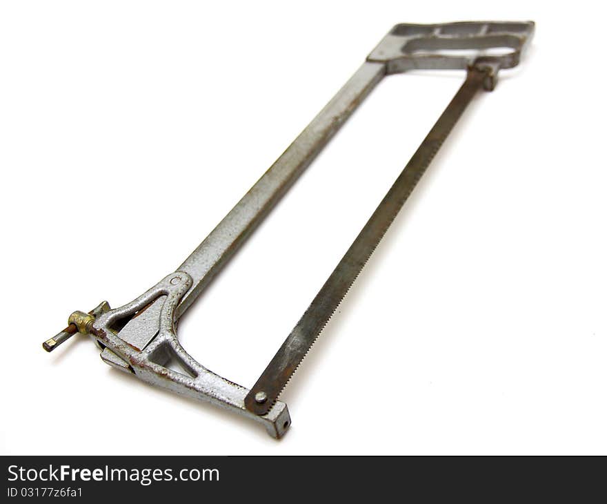 The old hacksaw on metal lies on a white background