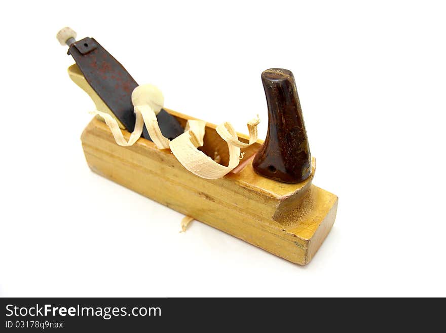 Wooden plane, boards and a shaving on a white background