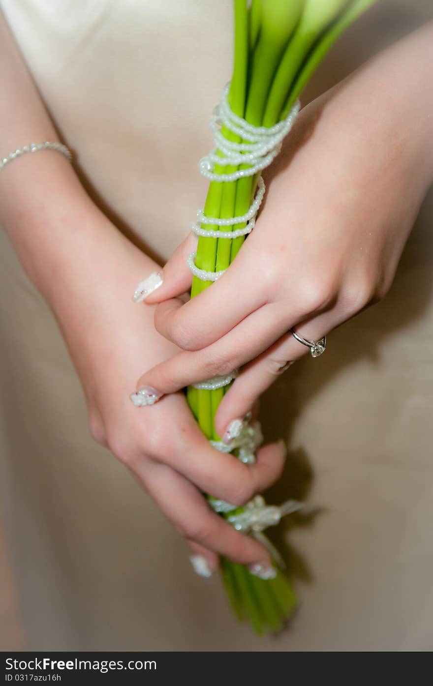 Bride was holding lily as her hand flower. Bride was holding lily as her hand flower