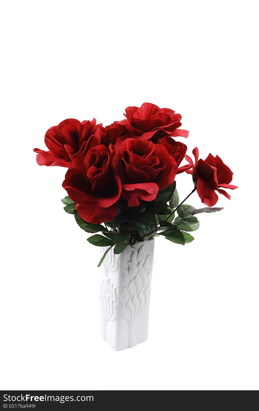 A bunch of red silk roses in a white vase for white background. A bunch of red silk roses in a white vase for white background.