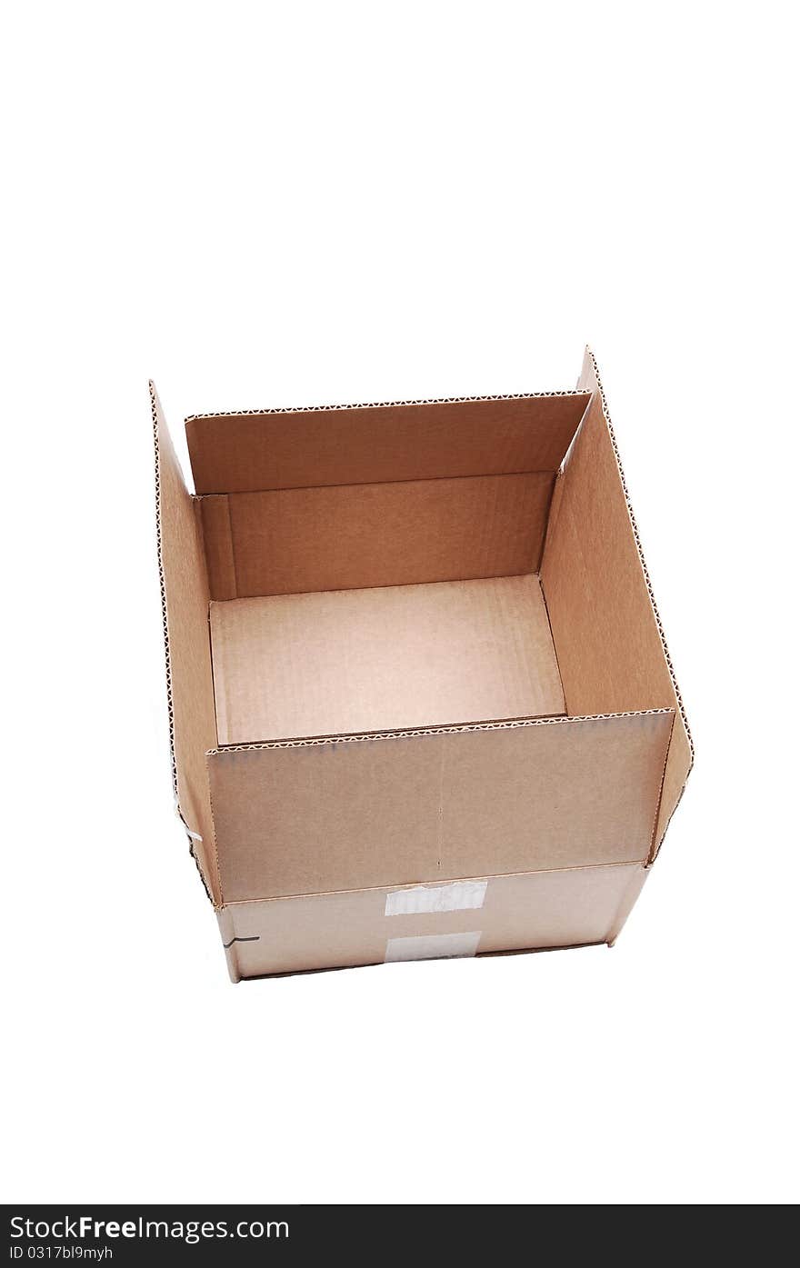 An empty used brown cardboard box sitting on white background with copy space. An empty used brown cardboard box sitting on white background with copy space.