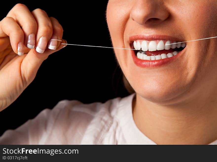 Woman healthy teeth closeup with toothbrush on black background. Woman healthy teeth closeup with toothbrush on black background