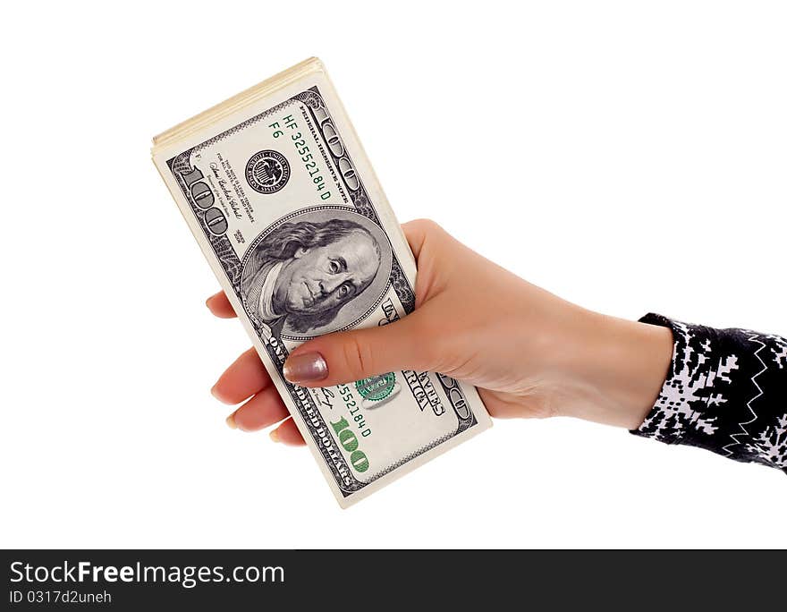 Pile of dollar s banknotes in female hand on white background