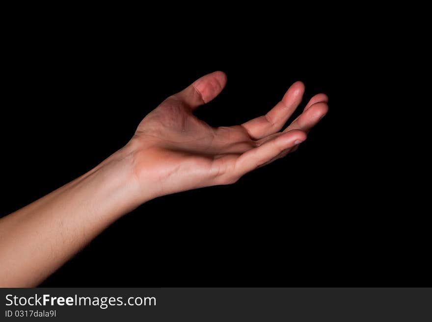 Male hand on black background