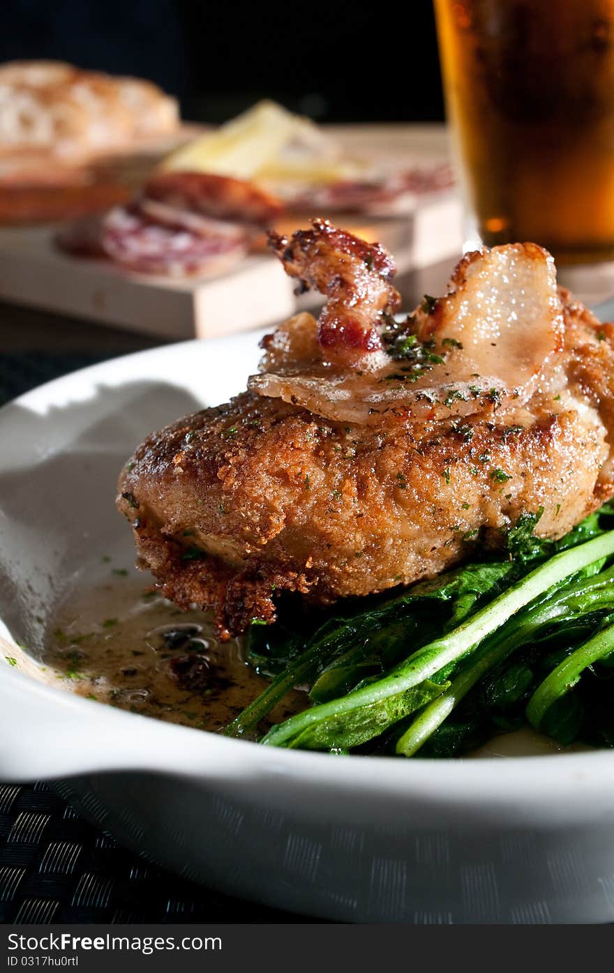 Sweetbreads with bacon over fresh greens. Sweetbreads with bacon over fresh greens