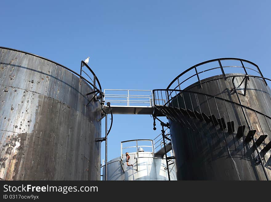 Storage tanks and blue sky. Storage tanks and blue sky