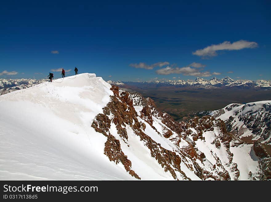 Roped group of climbers on the ridge