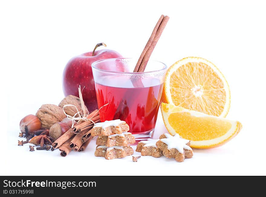 Mulled wine with spices and biscuits on white background. Mulled wine with spices and biscuits on white background