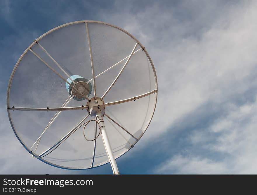 White satellite over blue sky