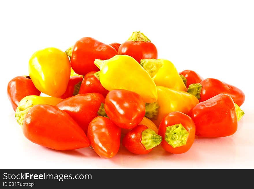 Acute multicolored peppers isolated on white background. Acute multicolored peppers isolated on white background