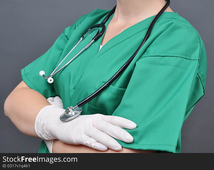 Attractive lady doctor on a over gray background