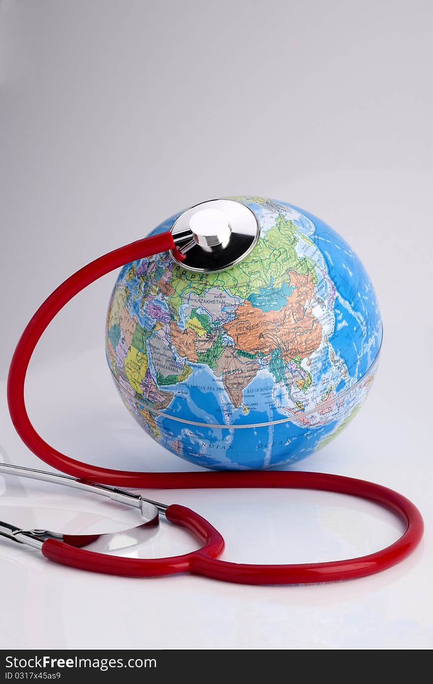 Red stethoscope on the Globe. Red stethoscope on the Globe