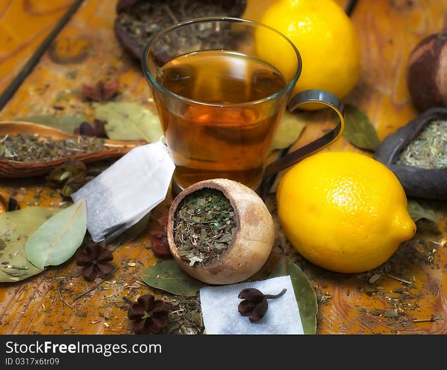 Cup of peppermint tea with diverse herbs and lemon