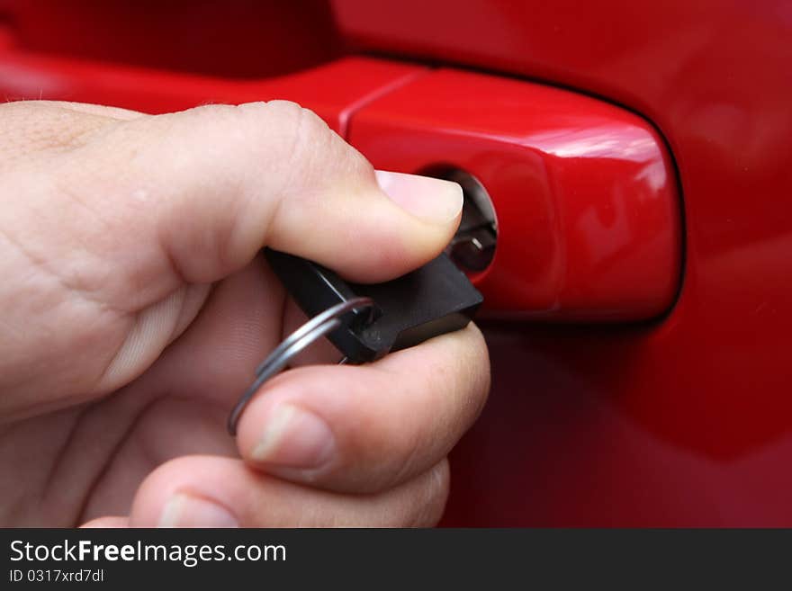 Young women open shes red car, photo taken for new cars commercial