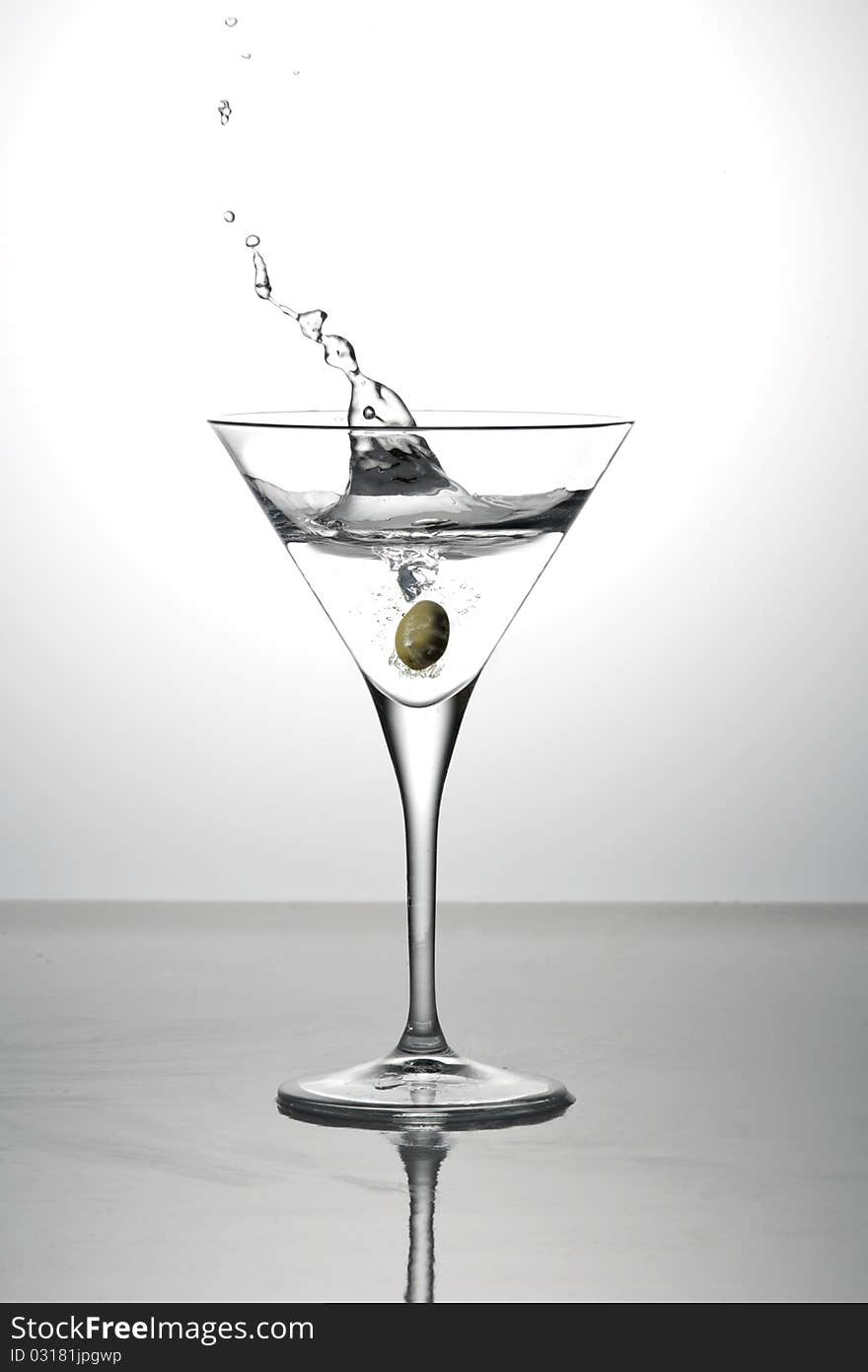 Olive Splashing Into A Cocktail