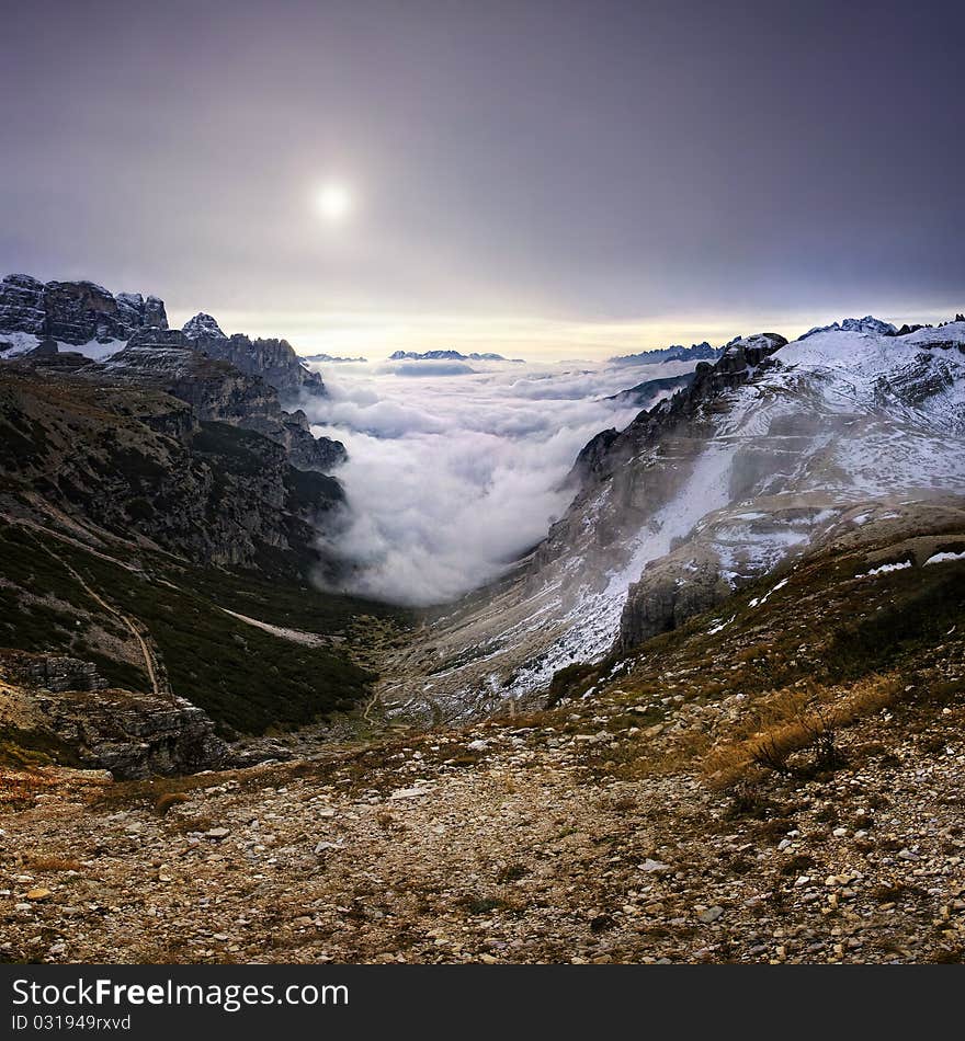 Stitched Panorama, Mountains over the fog in the autumn sunrise, Dolomity, Italy