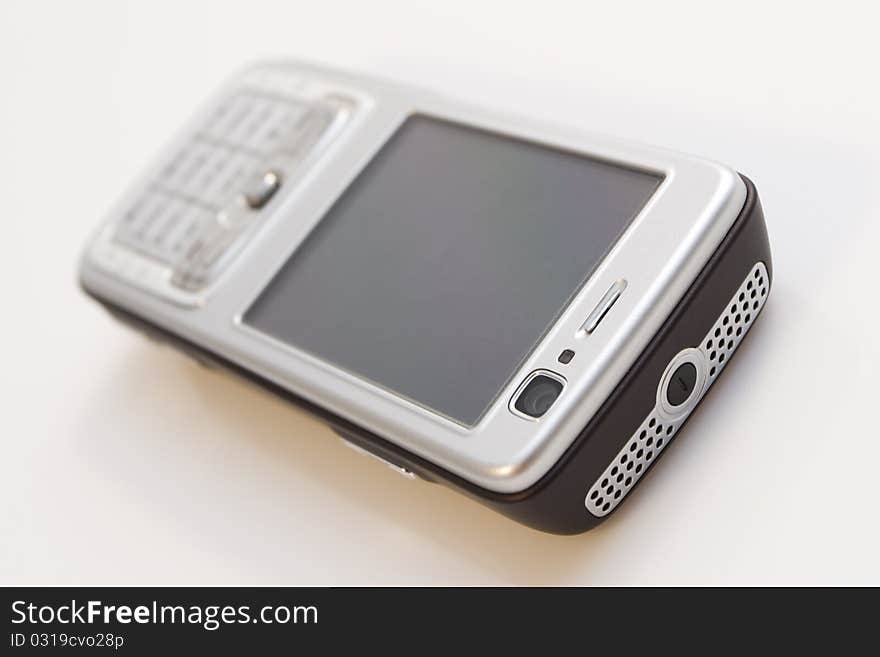 Close-up of silver mobile phone isolated on white background.