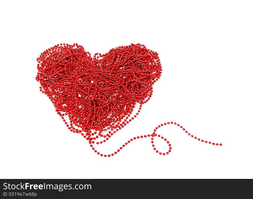 Red heart with beads. Isolated on white background.