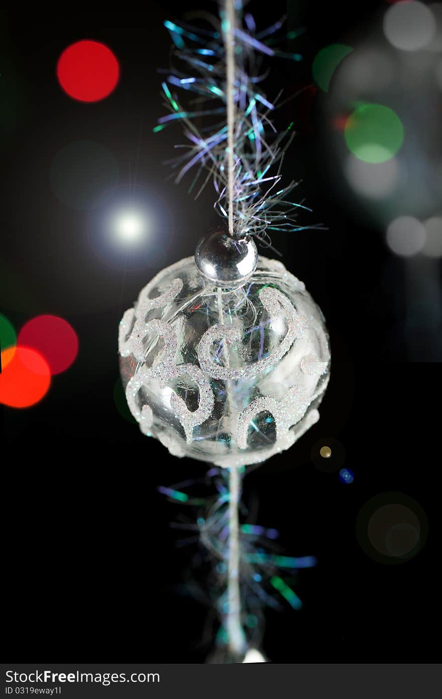 Transparent christmas ball on the black background