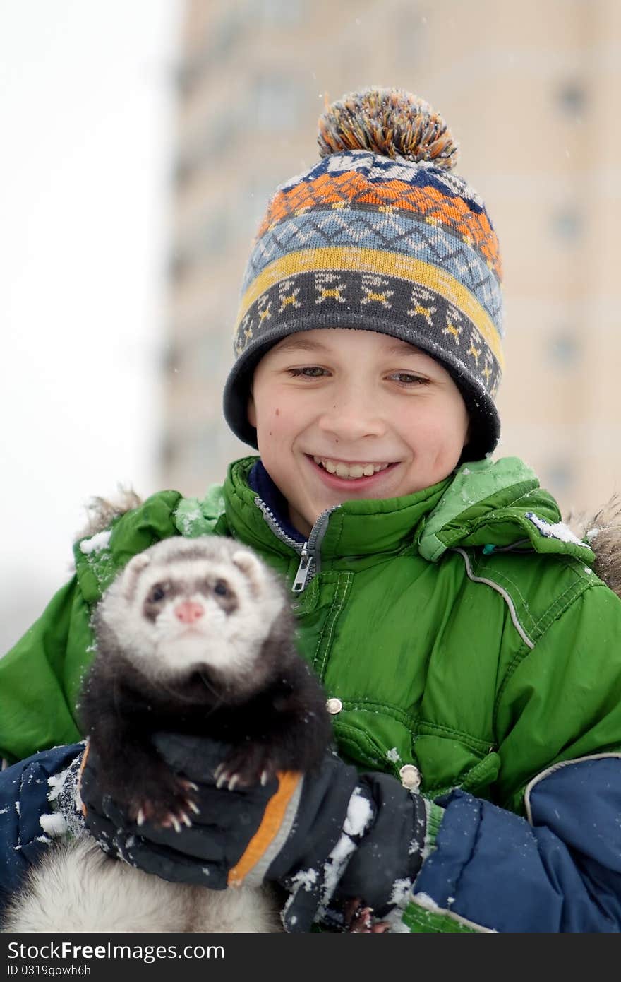 The Boy Holds A Polecat