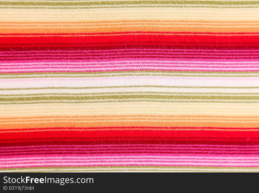 Textile background with lines of various colors