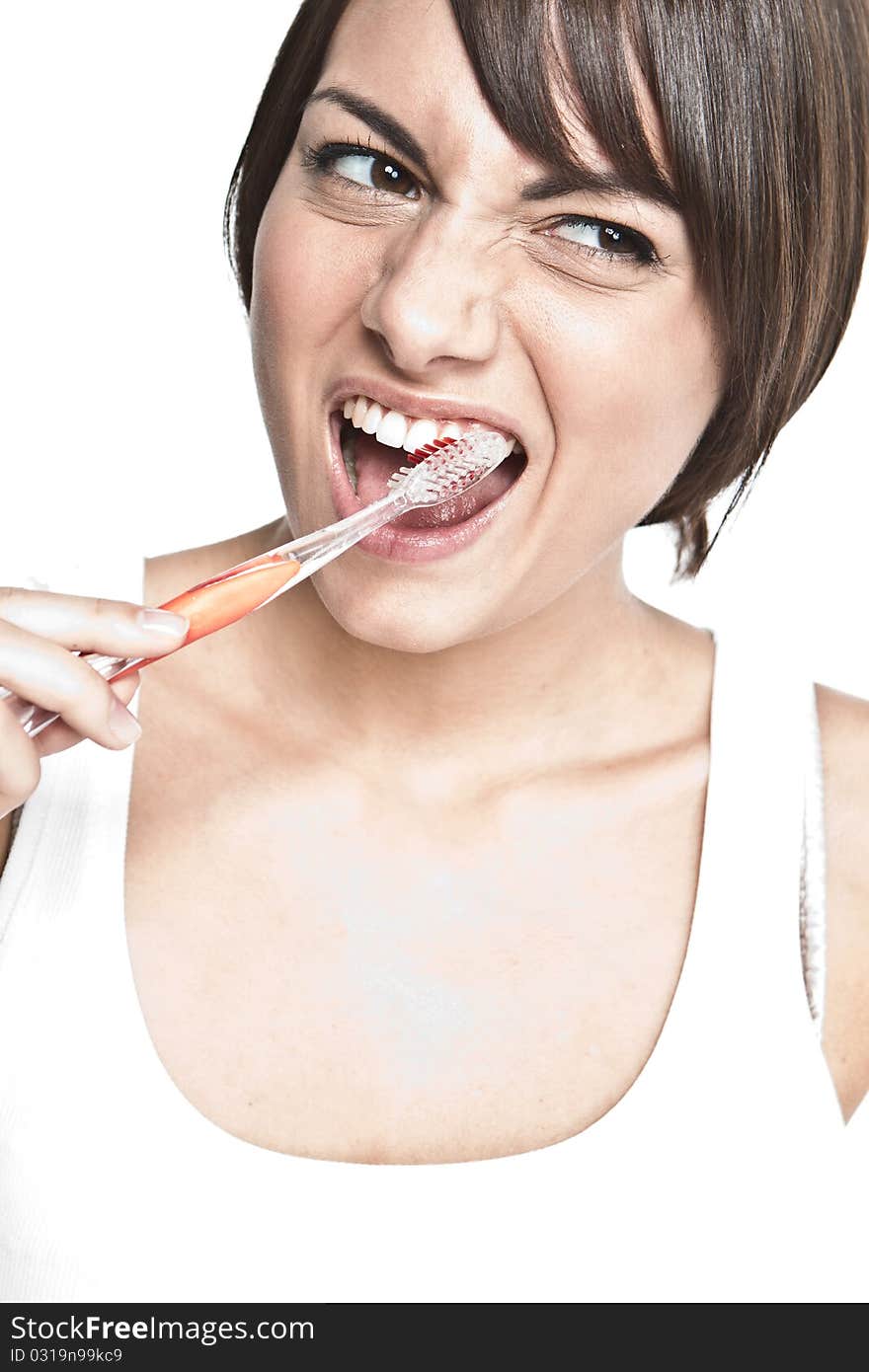 Young happy woman brushing teeth