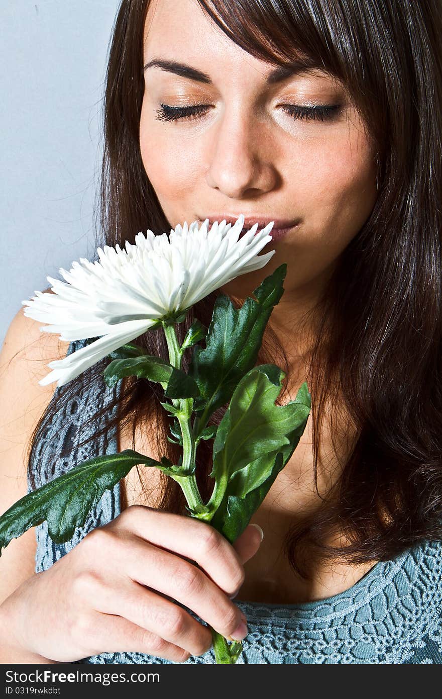 Young woman with flowers in her hand