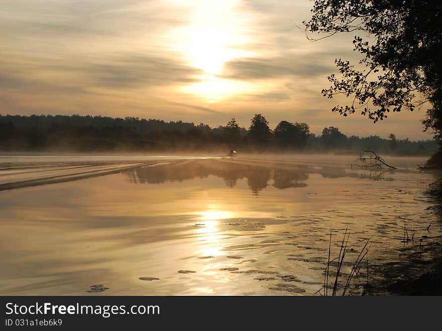 Decline on the river. A floating motor boat