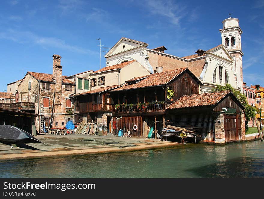 View of the old building with gondolas in the centre of Venice . View of the old building with gondolas in the centre of Venice .